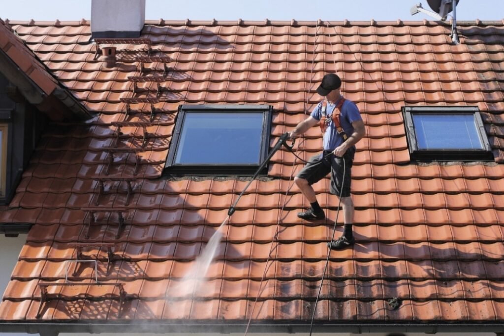 Man Cleaning the Roof