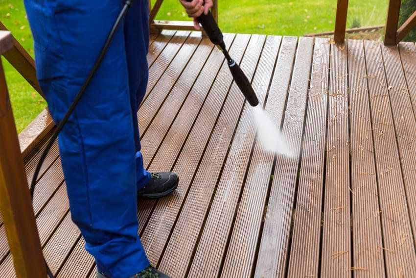 Outdoor Spaces That Deserve More Attention 1 Man Pressure Washing