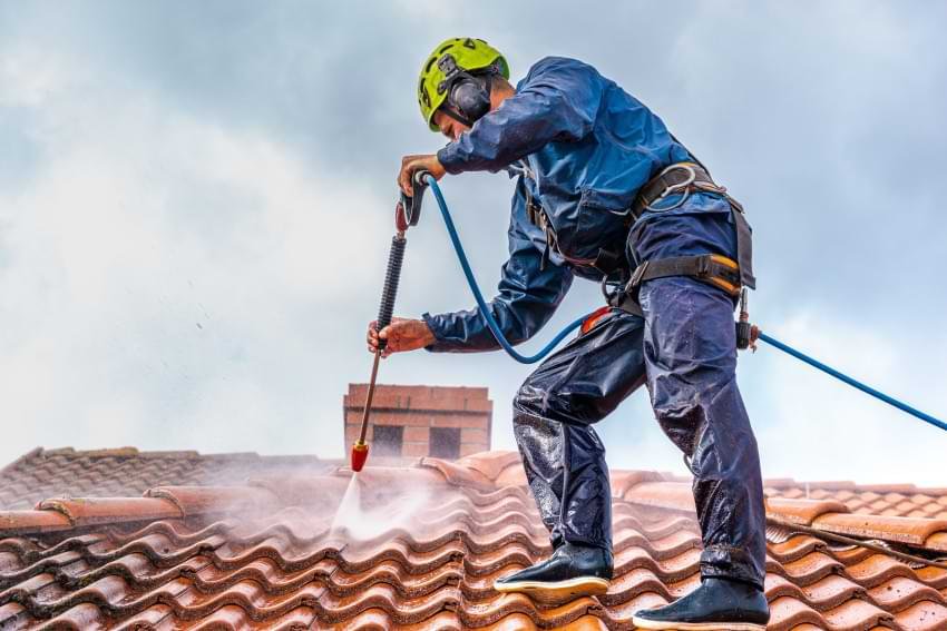 Man Cleaning Roof
