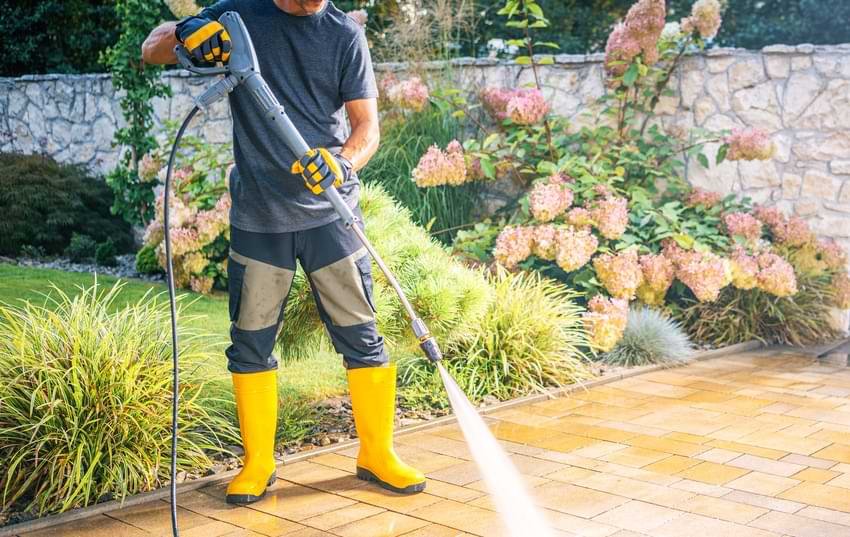 Man Using Pressure Washer