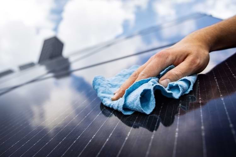 Hand Cleaning a Solar Panel